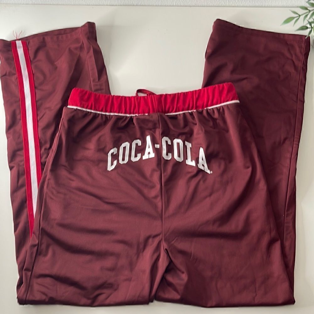 Coca-Cola silky soft sweatpants. Size Small. Drawstring waist. Pockets at waist.